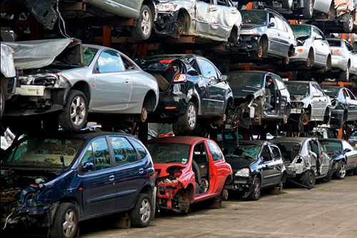 Depolluted scrap cars on racks ready to be recycled