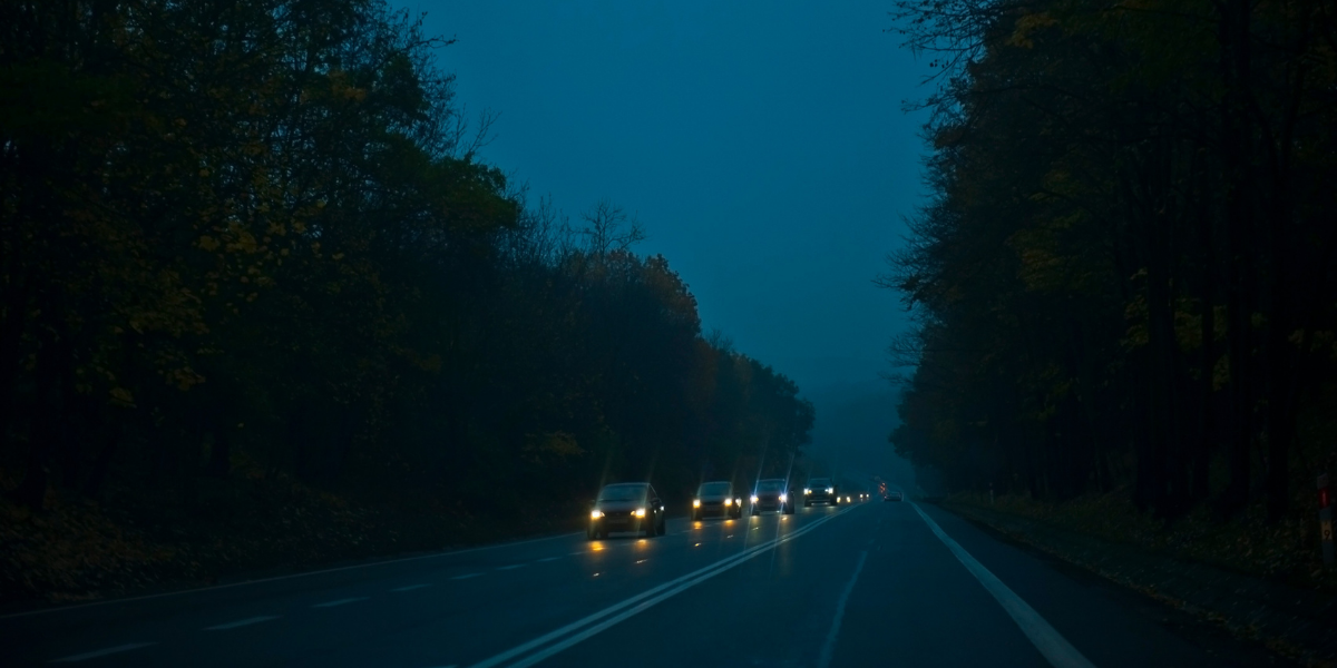 Photo of cars driving at night