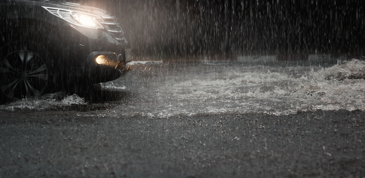 Photo of car on road in heavy rain